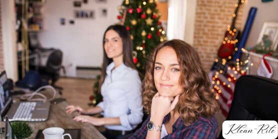 Two women working in a cleaning service office