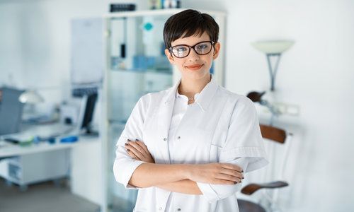 Portrait of female optometrist at eyesight medical clinic