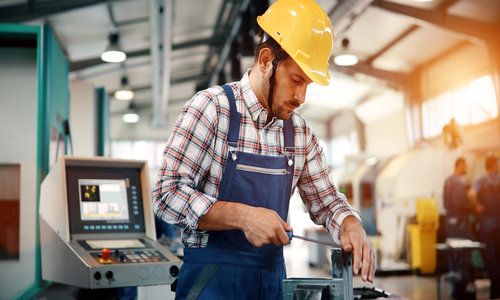 industrial factory employee working in metal manufacturing industry
