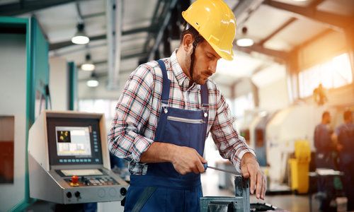 industrial factory employee working in metal manufacturing industry