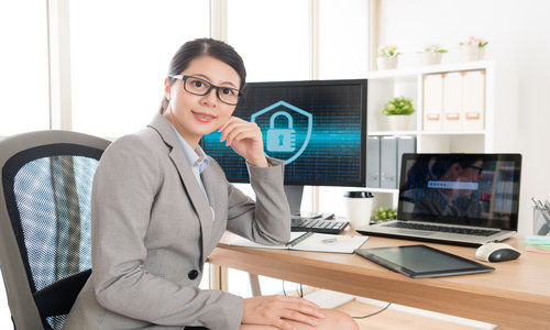 Female Business Worker Sitting in Workplace Office