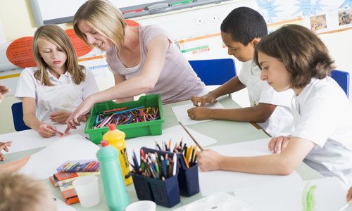 School Children and Their Teacher in an Art Class