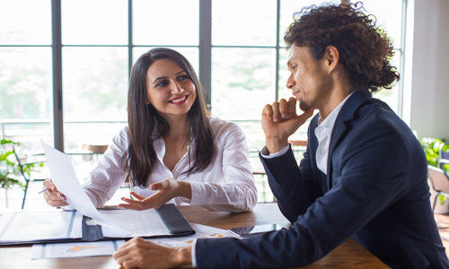 Happy Business Lady Explaining Contract Terms